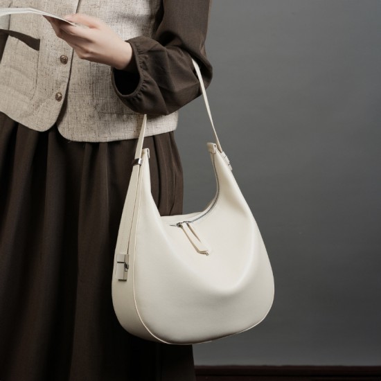 2025 spring and summer new niche design cowhide underarm bag, shoulder and handbag, genuine leather crescent bucket bag for women