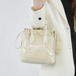 Song niche top-grain cowhide vintage drawstring handbag, single-shoulder/crossbody bucket bag, pleated genuine leather women's bag.