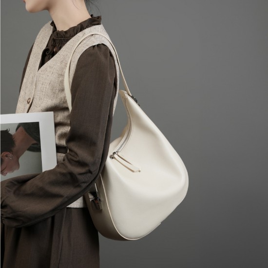 2025 spring and summer new niche design cowhide underarm bag, shoulder and handbag, genuine leather crescent bucket bag for women
